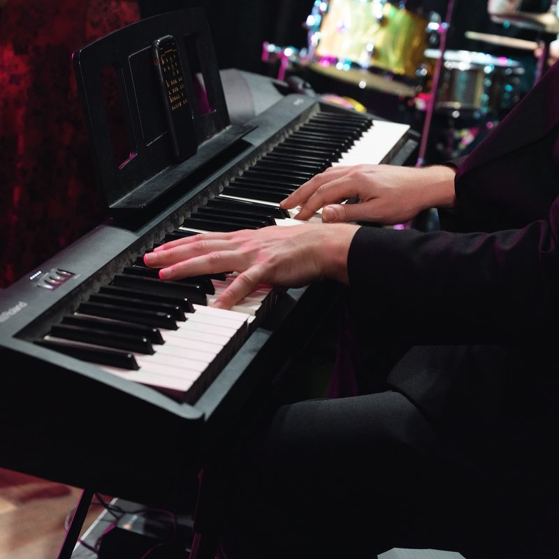 A pianist performing at Stage & Stem