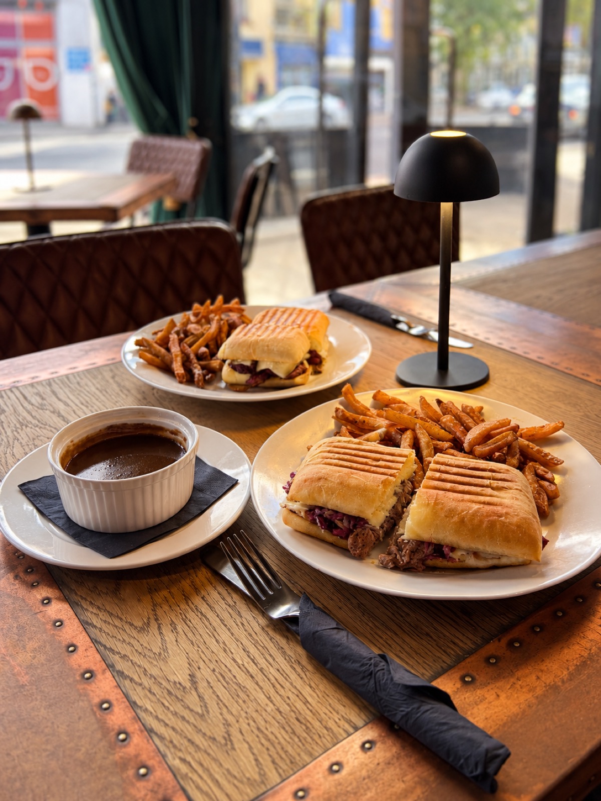 A plate of seasonal food and a glass of wine at the Stage & Stem bistro